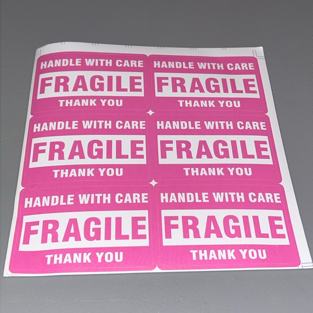Pink Fragile warning stickers